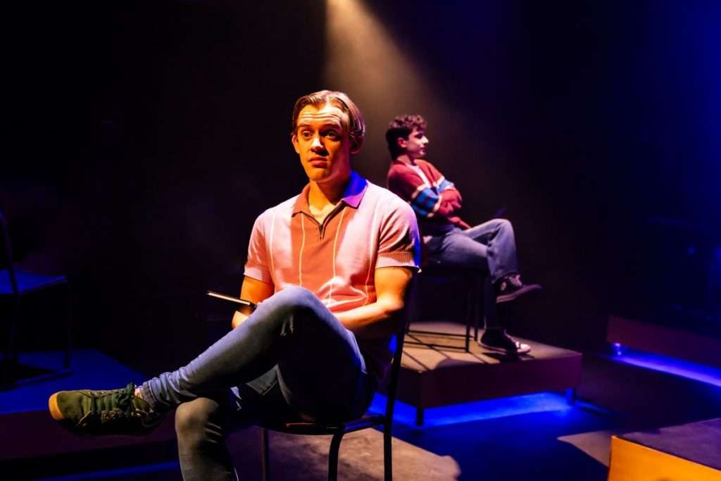 Jeff and Hunter sat in chairs looking pensive