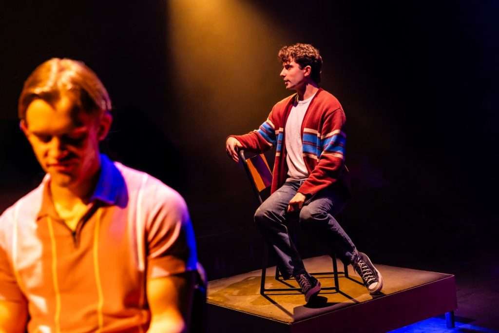 Hunter sat sideways on his chair looking into the distance dramatically